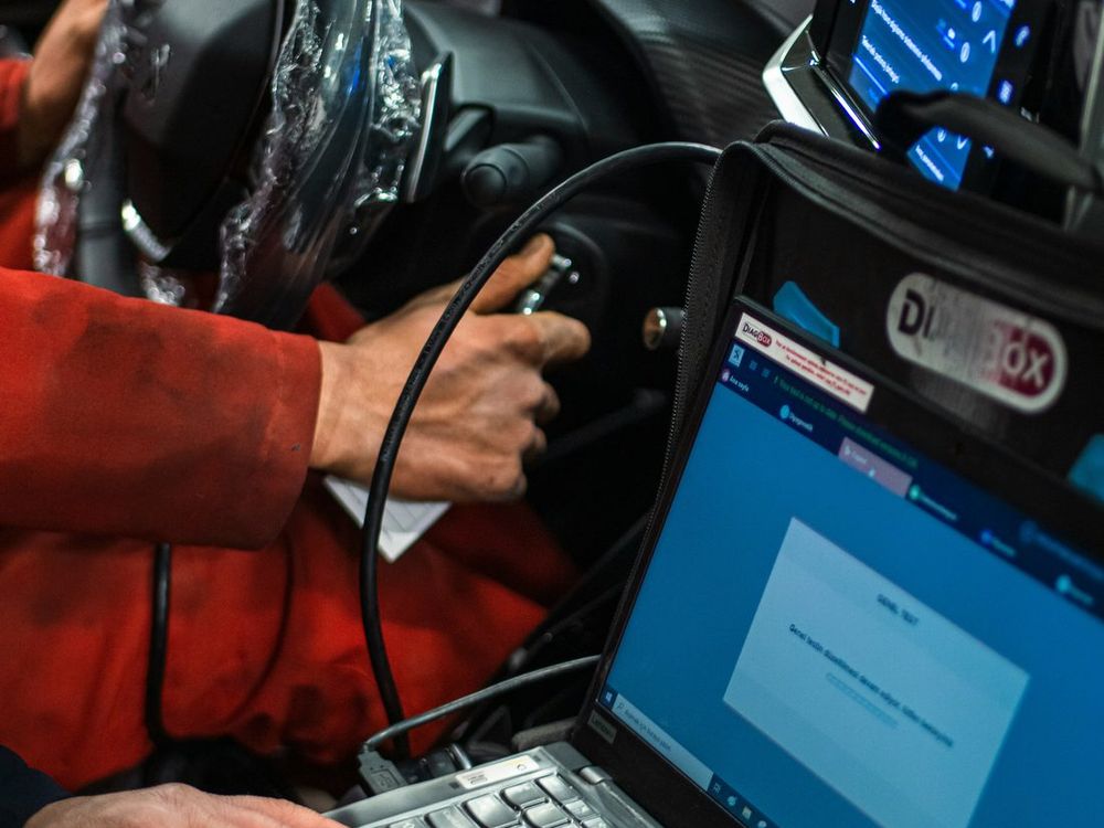 Technician running a diagnostic scan